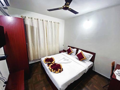 Ένα ή περισσότερα κρεβάτια σε δωμάτιο στο Applepie Residency