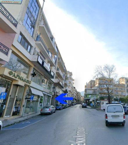 a city street with cars parked on the street at Blue Studio in Xanthi