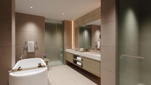 a bathroom with a toilet and a sink at Sani Club in Sani Beach