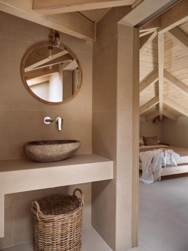 a bathroom with a sink and a mirror at Conte Maris IV in Tragaki