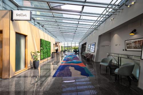 a hallway with a colorful carpet in a building at Clarion Hotel Bergen Airport in Bergen