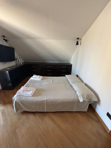 a bedroom with a large bed in a room at Cadorna36 in Locri
