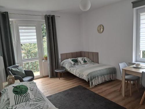 Ένα ή περισσότερα κρεβάτια σε δωμάτιο στο Apartament VERDE Malbork centrum