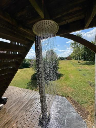 a bird net on a deck with a yard at The Annexe @ Mandalay Lodge in Medstead