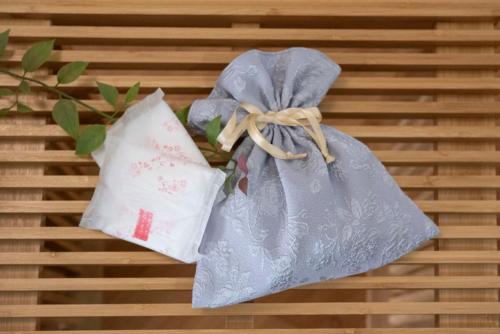 two blue and white bags on a table at kotinoma kuu in Hakozaki