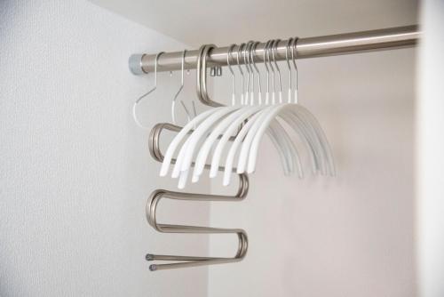 a towel rack in a bathroom with a chrome finish at kotinoma kuu in Hakozaki