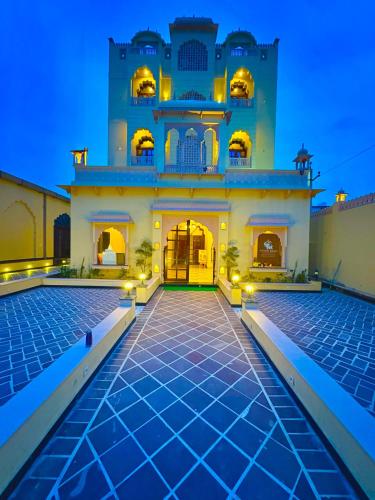 an exterior view of a building at night at Hotel Anand Bagh -Eraya Hotels in Phulera