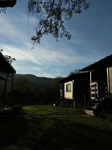 a cabin with a view of the mountains at Bungalouri Olanesti in Băile Olăneşti