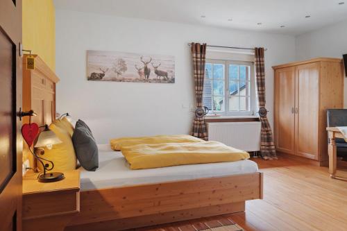 a bedroom with a bed in a room at Landhaus Christophorus in Forbach