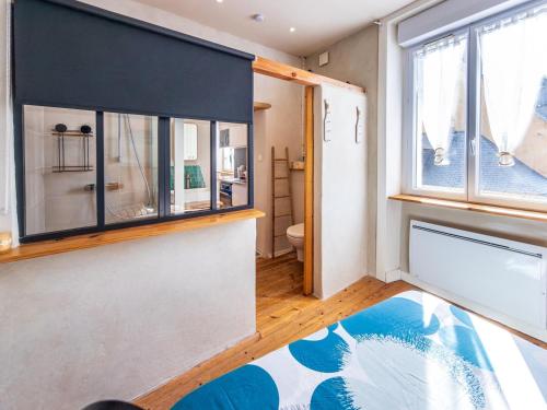a room with a bathroom with a large window at Cosy Primel - Plougasnou in Plougasnou