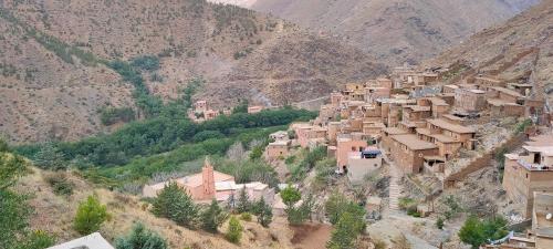 a village on the side of a mountain at Atlas Pearl in Aguersioual