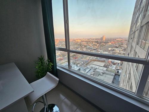 Posezení v ubytování Apartment steps from the Alameda Terminal, Escuela PDI, Estación de Trenes and USACH, Facturable