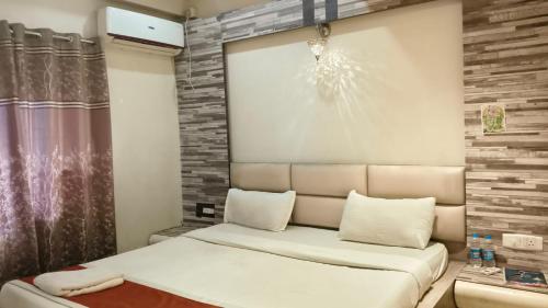 a small room with a couch and a window at Hotel A P Home's - A Boutique Hotel in Guwahati