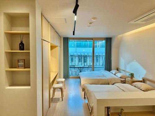 En eller flere senge i et værelse på Myeongdong Zero Distance