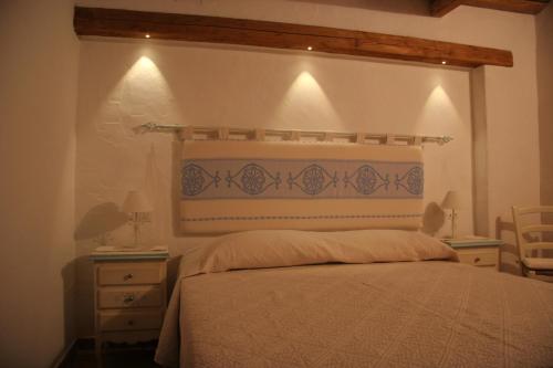 Ένα ή περισσότερα κρεβάτια σε δωμάτιο στο Agriturismo Fioredda