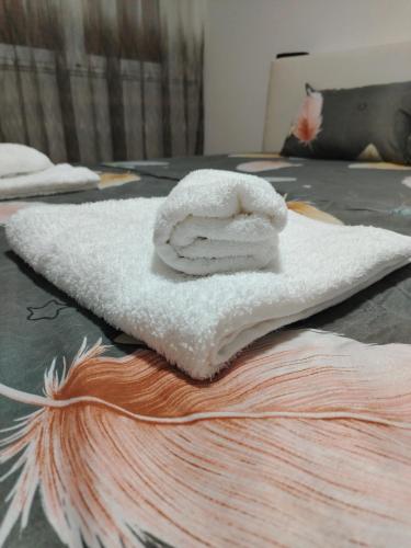 a white towel sitting on top of a table at Apartman Zdravković in Leskovac