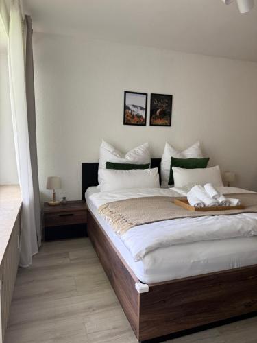 a bedroom with a large bed in a room at 1-Zimmer-Apartment in der Nähe der Therme und Hängebrücke in Bad Wildbad