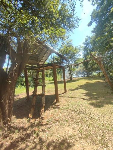 a tree house sitting in the shade of a tree at Sorabora like view camps in Mahiyangana