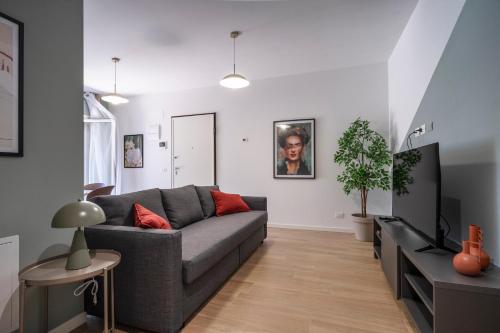 a living room with a couch and a table at Civita Living in Civitanova Marche