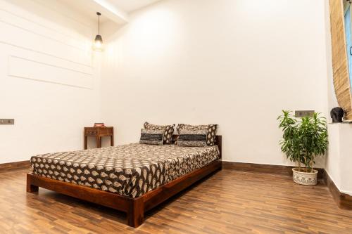a bedroom with a bed in a room at AnandMai Ghar - A Homestay in Gwalior in Gwalior