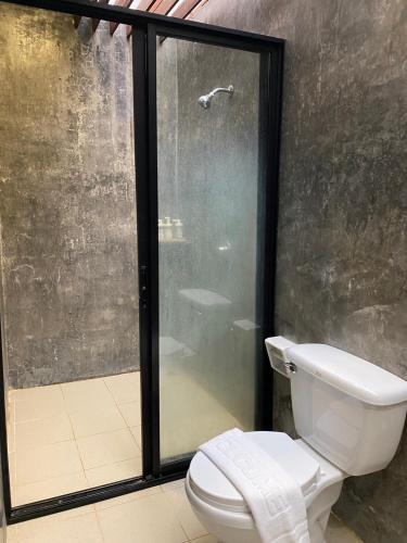 a bathroom with a toilet and a shower at baan in kan homestay&cafe kanchanaburi city in Kanchanaburi City