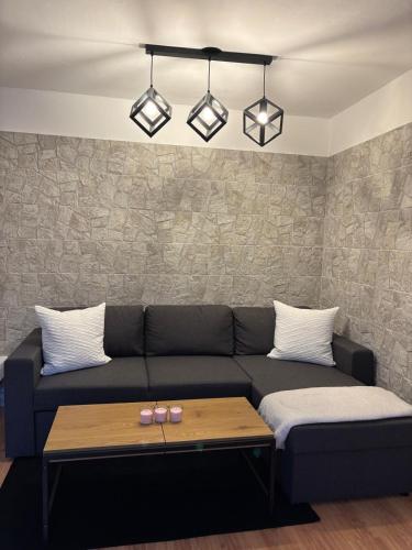 a living room with a couch and a table at Casa DiMont in Salino