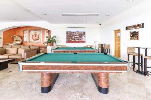 a living room with a pool table in it at ANANA El Dorado 305 | Pool & Lake Views in Ajijic