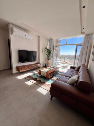 Μια τηλεόραση ή/και κέντρο ψυχαγωγίας στο Stayr Somabay - Bay Life Home Rentals