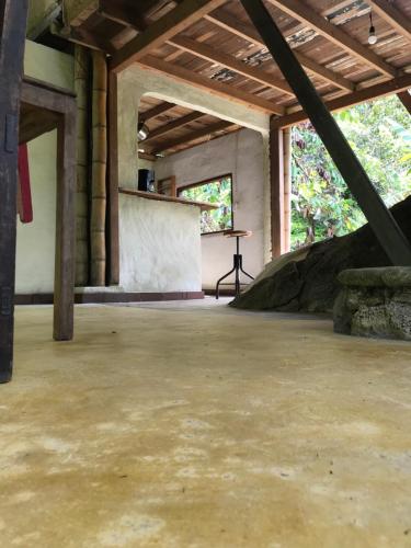 an empty room with a concrete floor and a table at Refugio Cumaná Entero in San Rafael