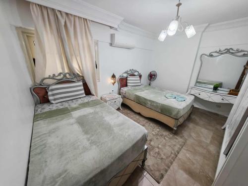 Postel nebo postele na pokoji v ubytování City Square Luxury Apartment on the Sea