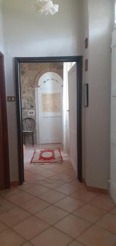 a hallway with a door open to a room at La Vecchia Quercia in Pergine Valdarno