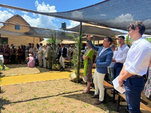 a group of people standing under a tent at Nyanja View Resort in Fort Portal