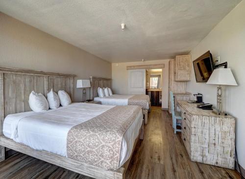 Ένα ή περισσότερα κρεβάτια σε δωμάτιο στο Hotel DeVille