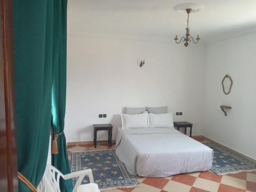 Ένα ή περισσότερα κρεβάτια σε δωμάτιο στο Riad JOUHARA