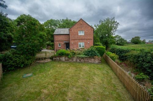 an aerial view of a brick house with a yard at Sandstone 34 in Chester