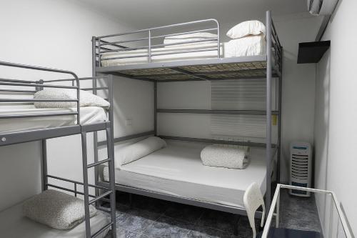 a bunk bed room with two bunk beds in it at Habitación Familiar in Madrid