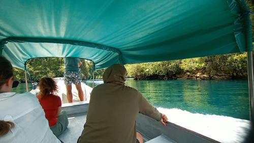 a group of people on a boat in the water at manyaifun guest house in Minyaifuin