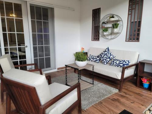 a living room with a couch and a table at Lakefront Paradise Retreat, Private Pool Vacation Home in Rivas, between Ometepe, Tola and San Juan del Sur in San Jorge