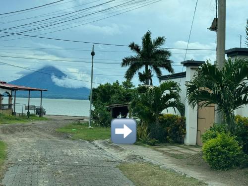 a trash can sitting on the side of a road at Lakefront Paradise Retreat, Private Pool Vacation Home in Rivas, between Ometepe, Tola and San Juan del Sur in San Jorge