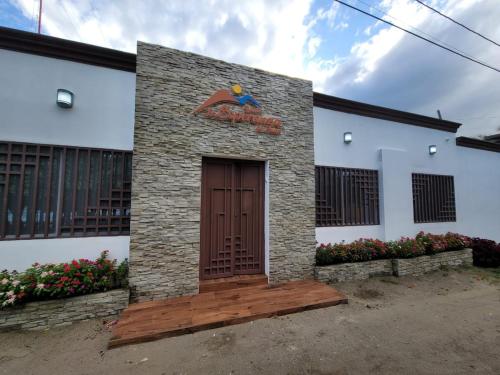 a building with a door with a statue on it at Lakefront Paradise Retreat, Private Pool Vacation Home in Rivas, between Ometepe, Tola and San Juan del Sur in San Jorge