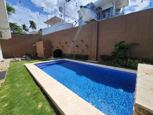 a swimming pool in the yard of a house at Lakefront Paradise Retreat, Private Pool Vacation Home in Rivas, between Ometepe, Tola and San Juan del Sur in San Jorge