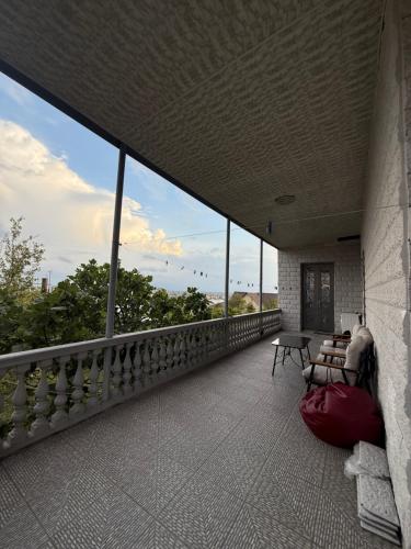 a balcony of a building with a view of the sky at AIA Apartment in Kutaisi