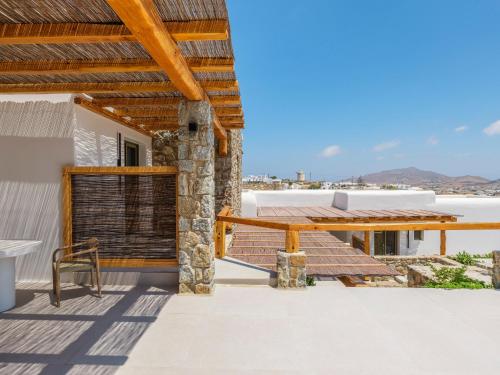 a balcony with a view of a house at Mykonian Shades in Ano Mera
