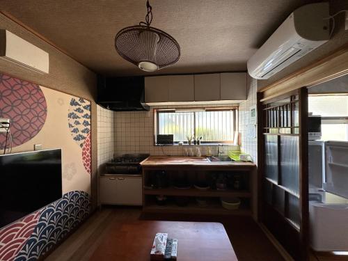 a small kitchen with a sink and a counter at Numazu - House - Vacation STAY 59955v in Numazu
