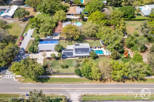an aerial view of a house with a park at Luxury Retreat: Pool Games Basketball More in Largo