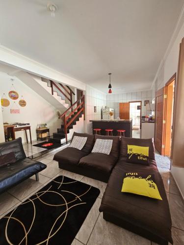 a living room with a couch and a table at Serradocipó-Casadorey in Serra do Cipo