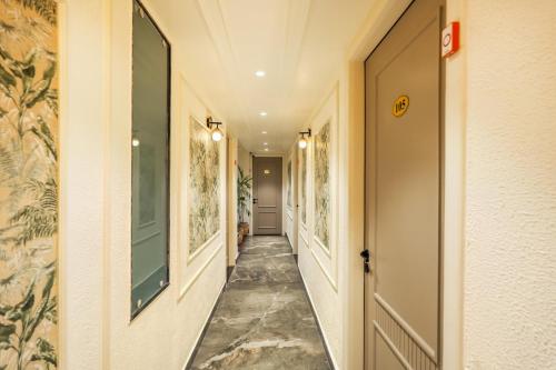 a corridor of a hallway with a hallway at Elegance A Boutique Stay in Amritsar