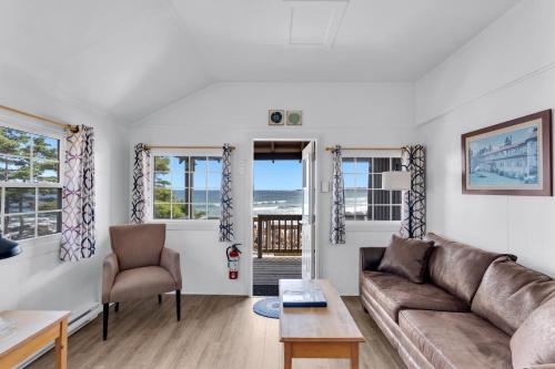 a living room with a couch and a table at White Point Beach Resort in Summerville Centre