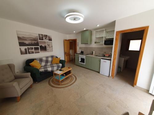 a living room with a couch and a table at La Vista Secreta in Oria