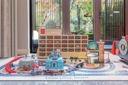 a toy train yard with a toy train station at Hilton Shanghai Songjiang Guangfulin in Songjiang